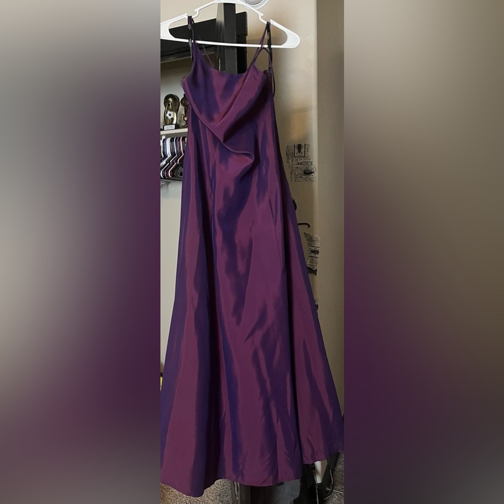 This dress is a Roberta prom dress. Color is purple